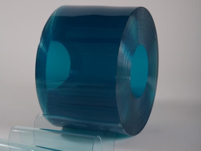 large roll of transparent blue PVC strip material, designed for low-temperature environments and cold storage applications