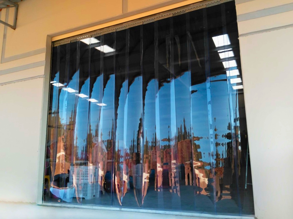 PVC strip curtain at a warehouse entrance.
