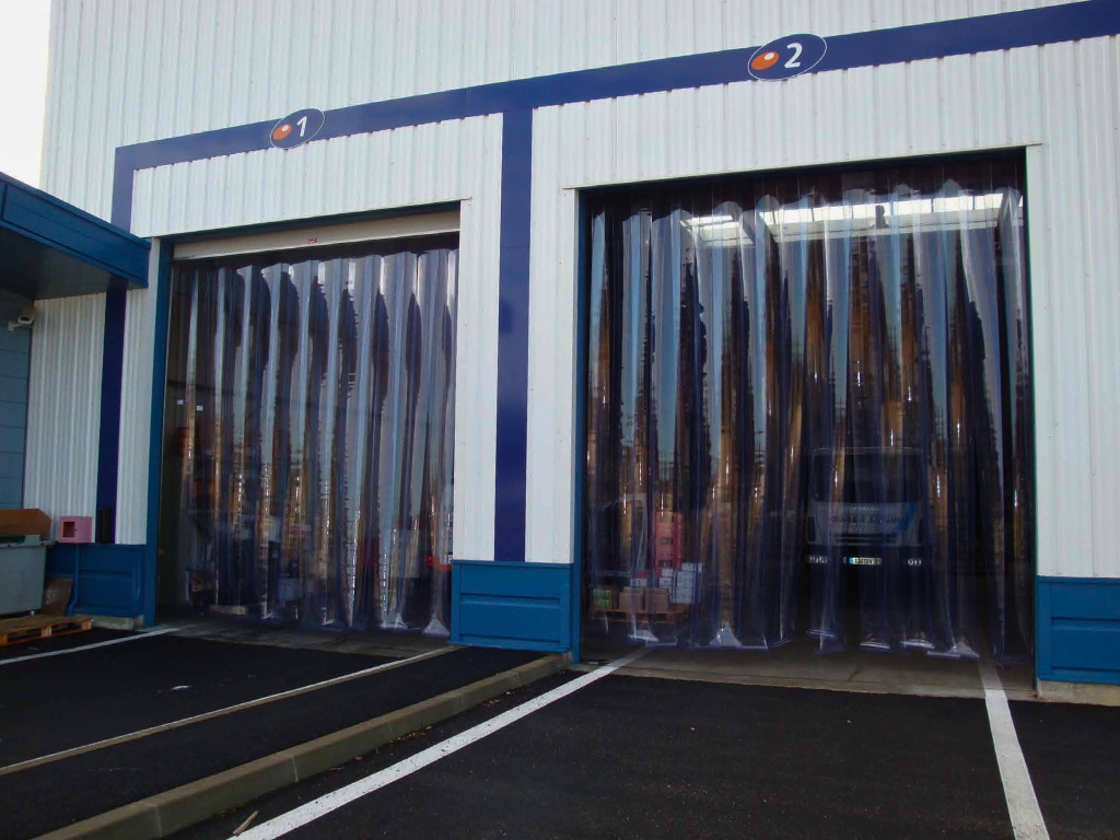 Two warehouse doorways with PVC strip curtains.